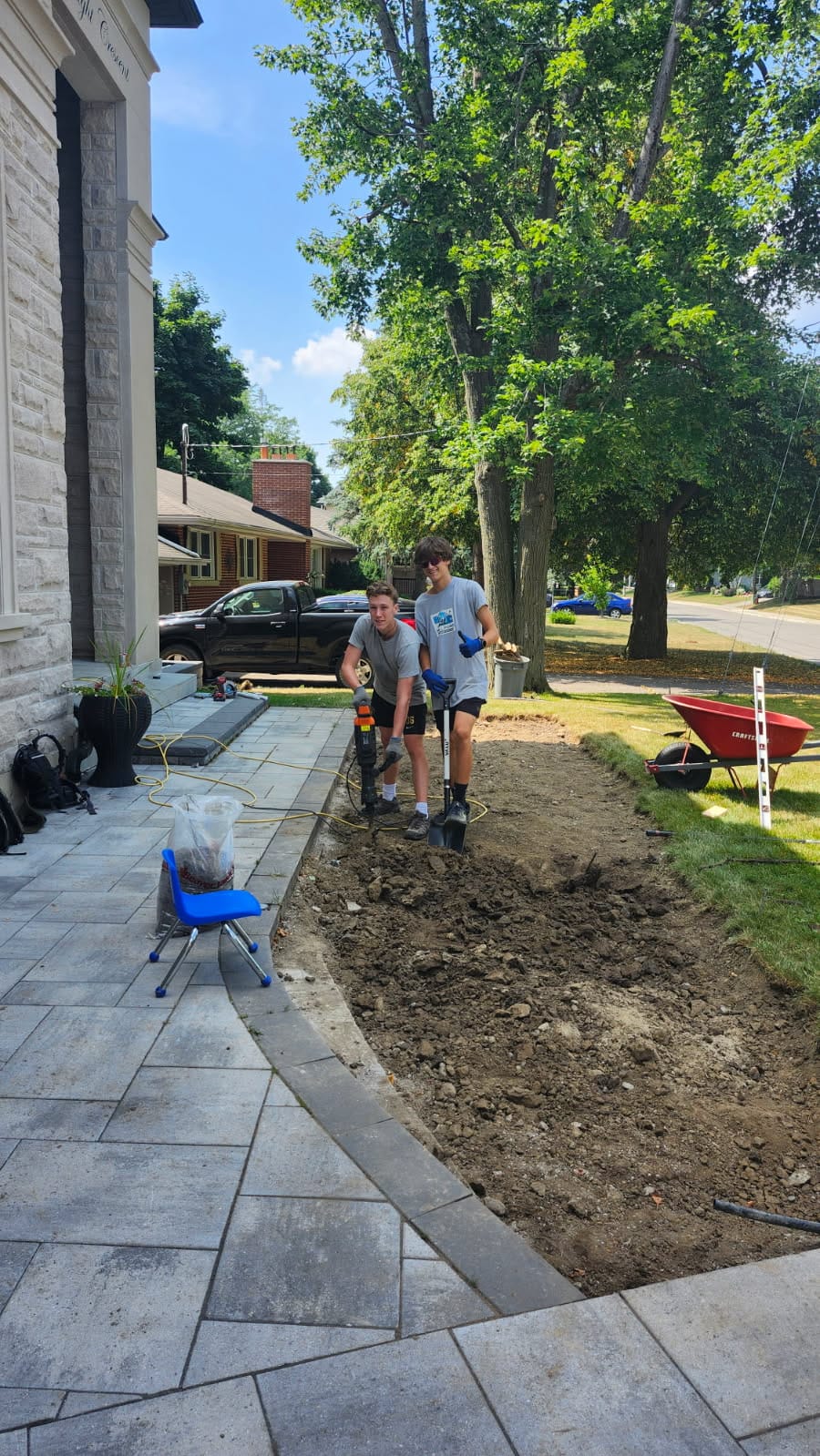 Ethan and Adam doing landscaping work
